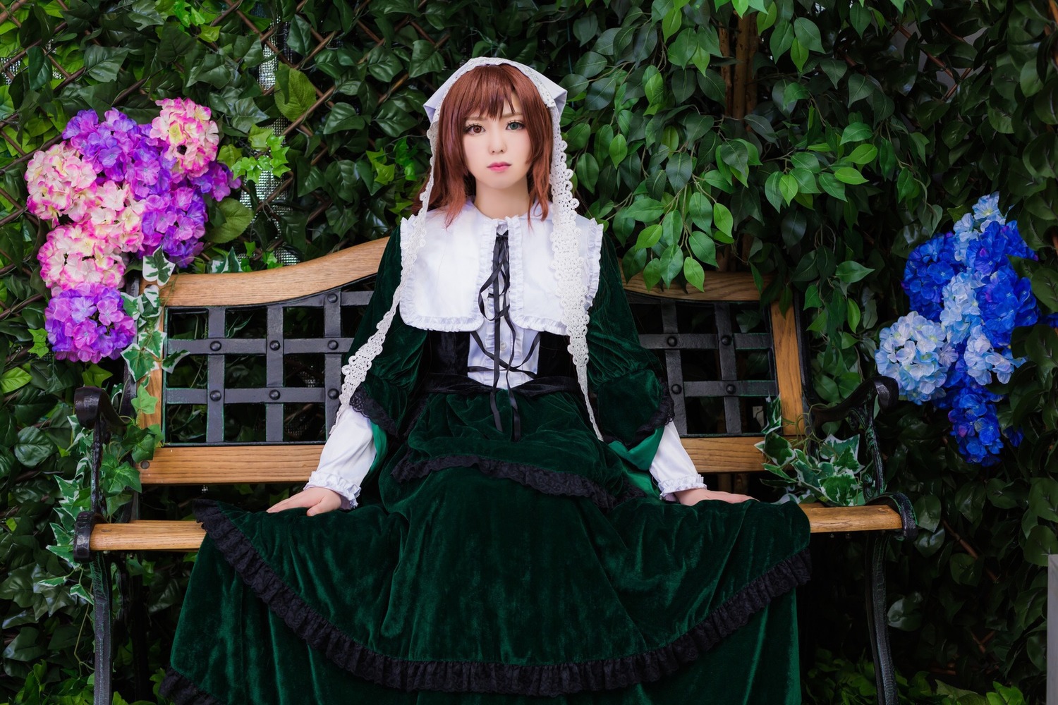 1girl blue_flower brown_hair dress flower hydrangea long_sleeves outdoors pink_flower plant purple_flower solo suiseiseki water