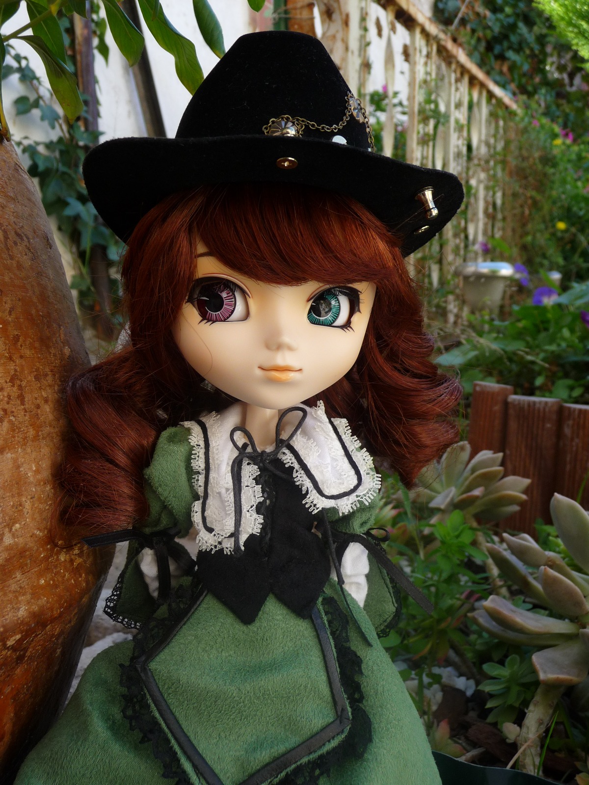 1girl black_neckwear bow doll dress eyelashes green_dress hat lace lips looking_at_viewer plant solo suiseiseki swept_bangs top_hat