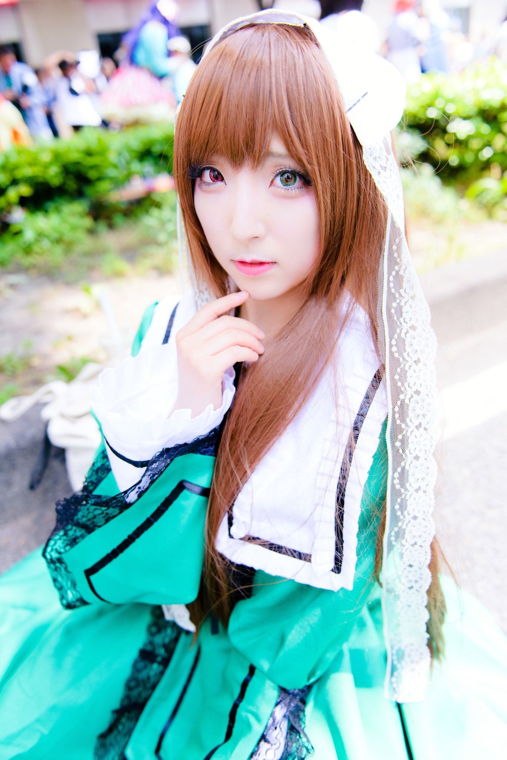 1girl 3d bangs blurry blurry_background blurry_foreground brown_hair depth_of_field lips long_hair looking_at_viewer photo solo suiseiseki