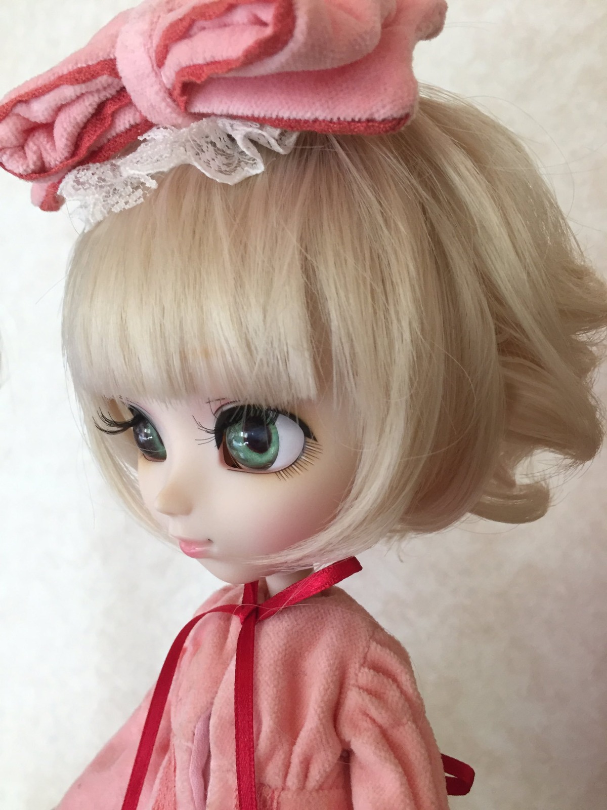 1girl blonde_hair doll hinaichigo red_ribbon ribbon short_hair solo upper_body