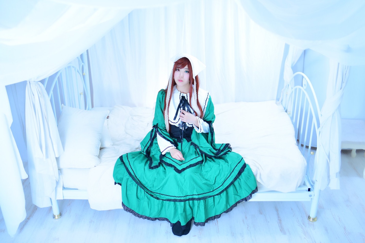 1girl brown_hair dress green_dress long_dress long_hair long_sleeves sitting solo suiseiseki