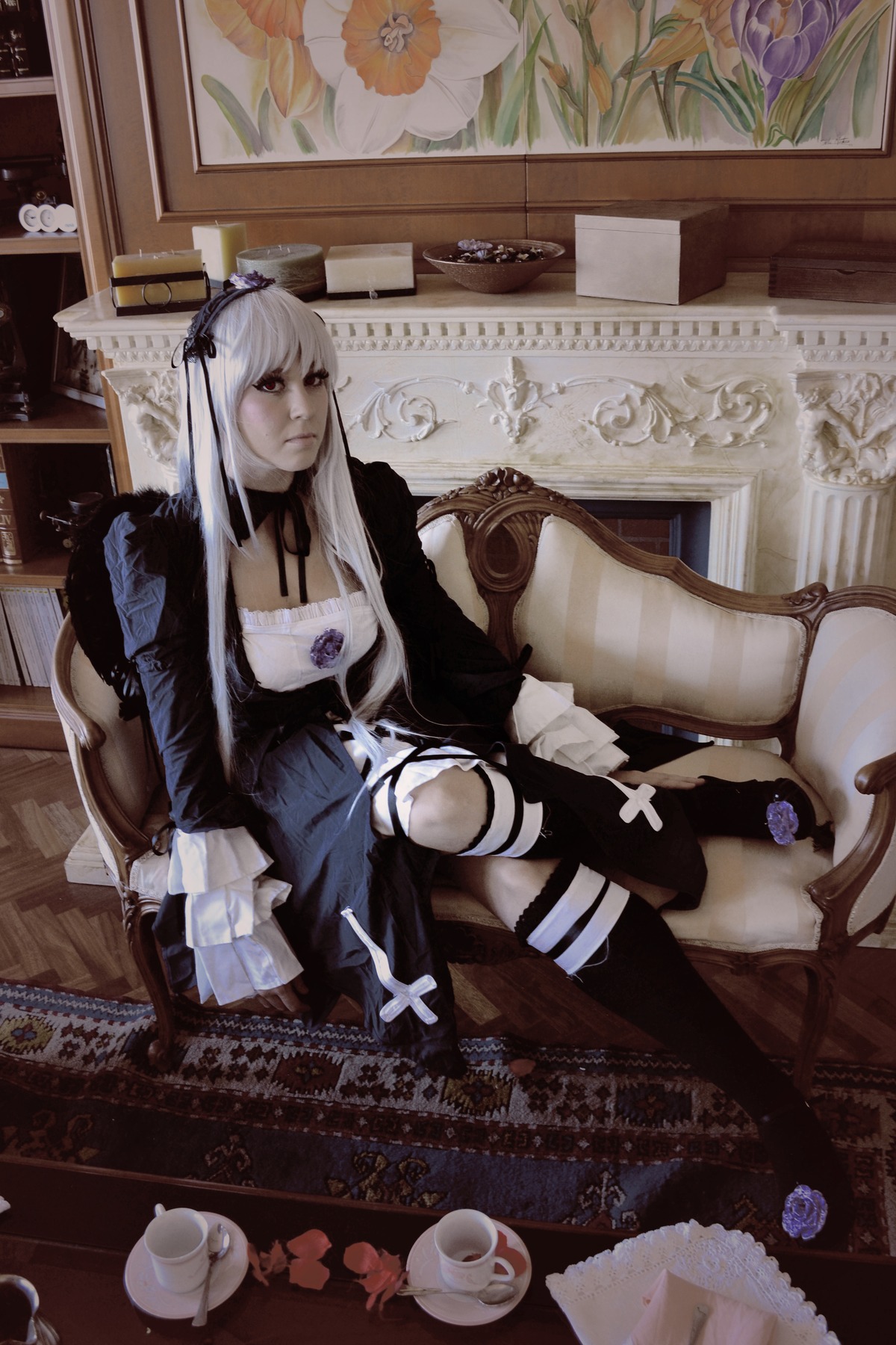 1girl cup dress flower long_hair long_sleeves rose silver_hair sitting solo suigintou teacup