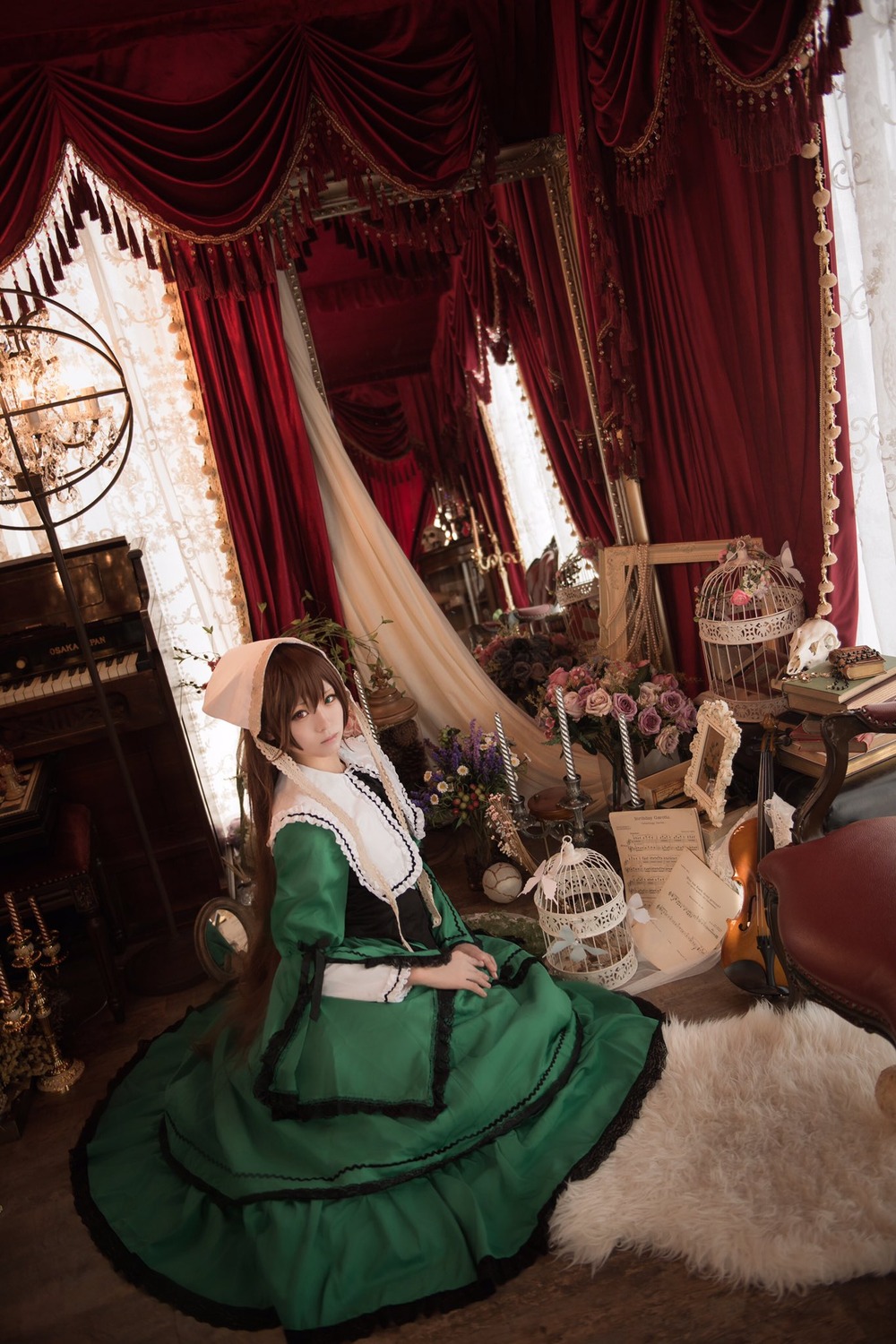 1girl brown_hair curtains dress flower green_dress indoors long_sleeves looking_at_viewer rose sitting solo suiseiseki vase window