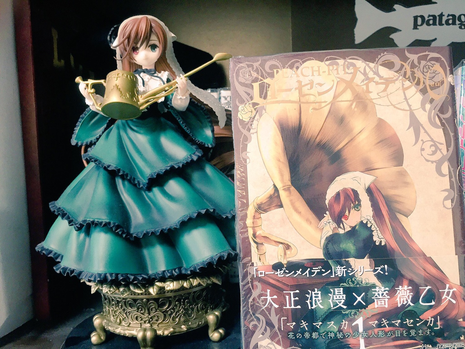 2girls blue_dress brown_hair doll dress flower frills green_dress heterochromia long_hair long_sleeves multiple_girls siblings sisters solo souseiseki standing suiseiseki twins