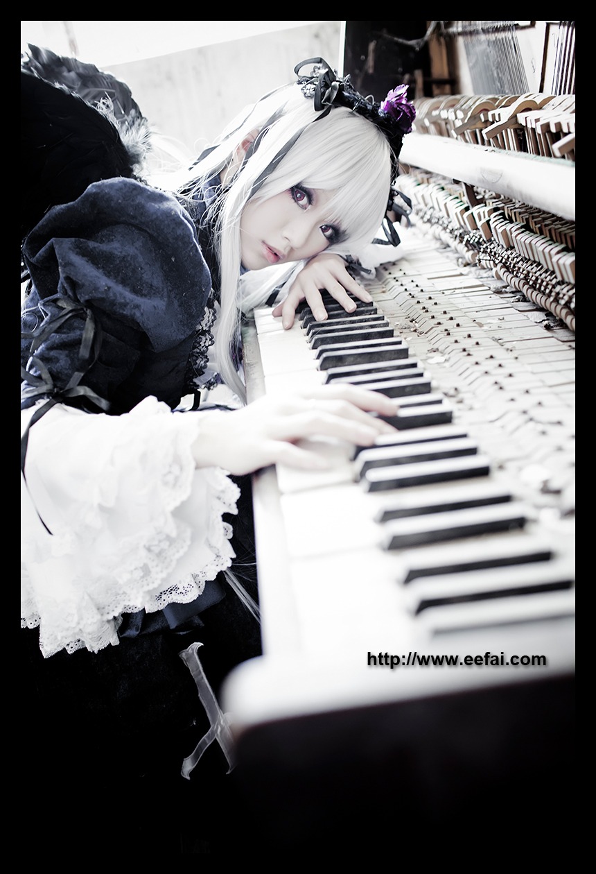 1girl blurry crown depth_of_field dress feathers frills letterboxed lips long_hair nail_polish solo suigintou white_hair wings