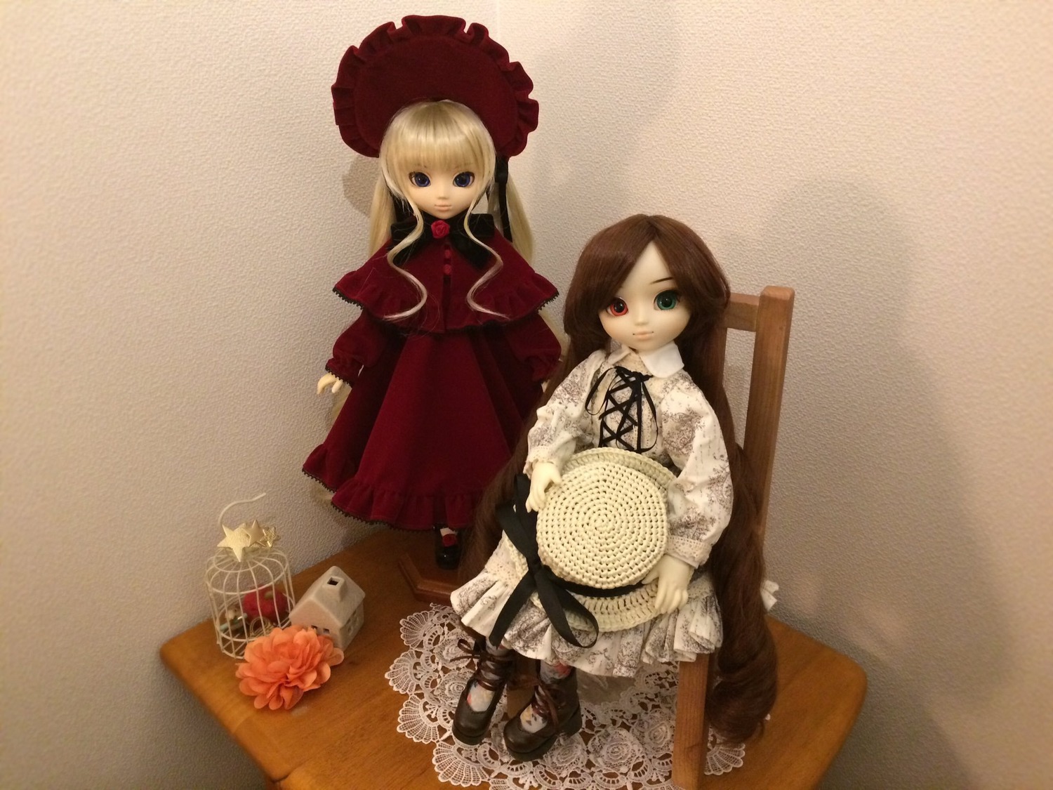2girls blonde_hair blue_eyes doll dress flower green_eyes heterochromia long_hair long_sleeves looking_at_viewer multiple_dolls multiple_girls red_dress red_eyes rose shinku sitting suiseiseki tagme