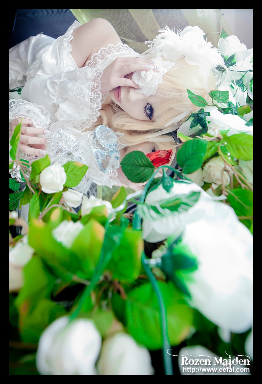 1girl bare_shoulders black_border blonde_hair blurry depth_of_field dress flower kirakishou leaf letterboxed lips long_hair pillarboxed solo white_dress windowboxed