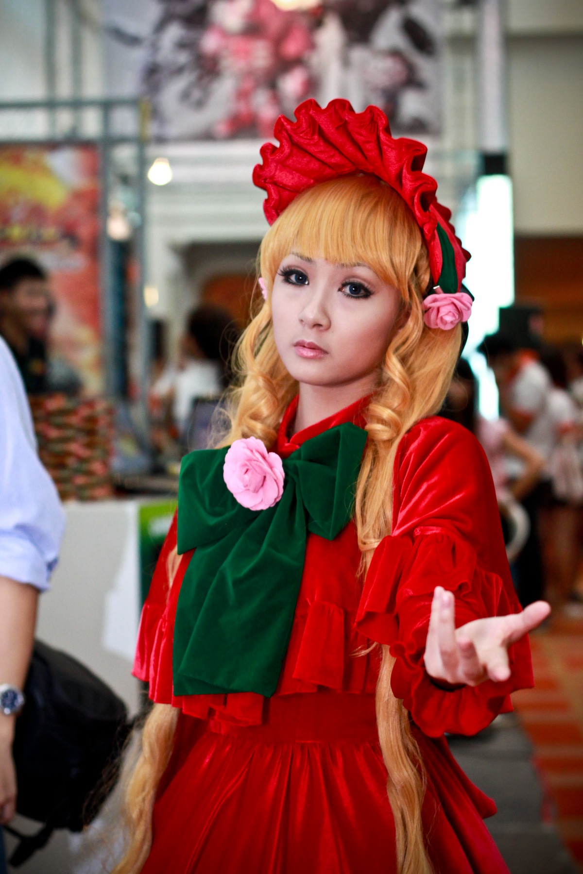 blonde_hair blurry blurry_background blurry_foreground bonnet depth_of_field dress drill_hair figure flower lips multiple_girls photo photo_background pink_flower pink_rose red_dress red_flower red_rose rose shinku solo solo_focus