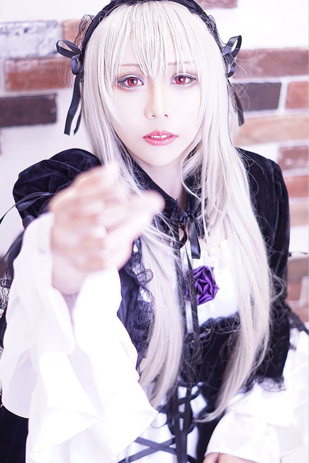 1girl 3d blurry chain depth_of_field flower hairband long_hair long_sleeves looking_at_viewer pale_skin photo red_eyes rose solo suigintou