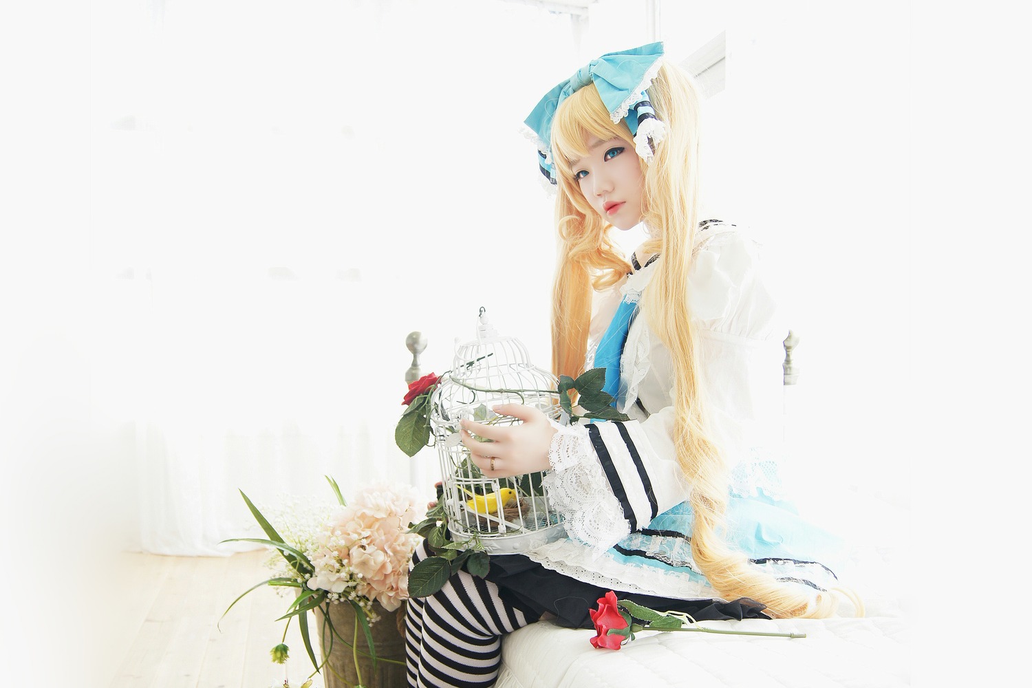 1girl blonde_hair blue_eyes elbow_gloves flower lips long_hair ribbon shinku solo striped striped_legwear