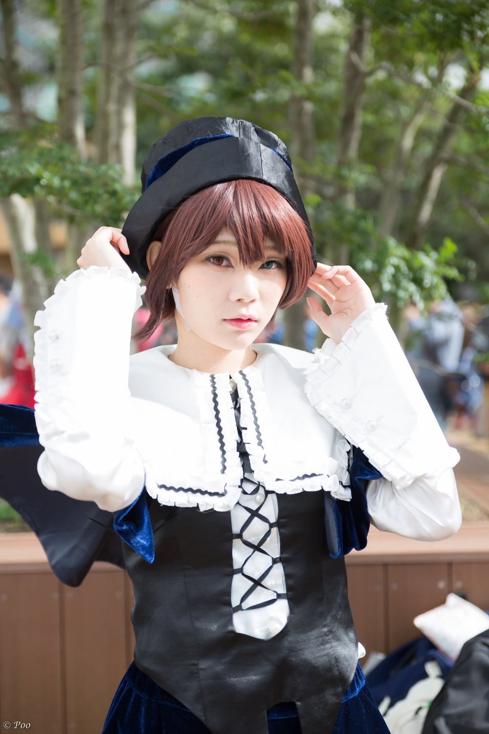 1girl blurry blurry_background blurry_foreground day depth_of_field dress hat jewelry lips long_sleeves looking_at_viewer necklace outdoors solo souseiseki