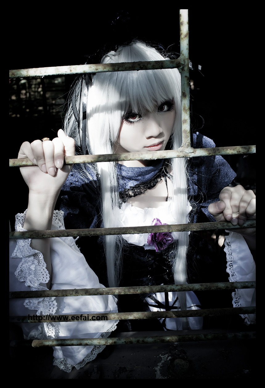 1girl auto_tagged bangs black_background choker dress frills holding lips long_sleeves solo suigintou upper_body