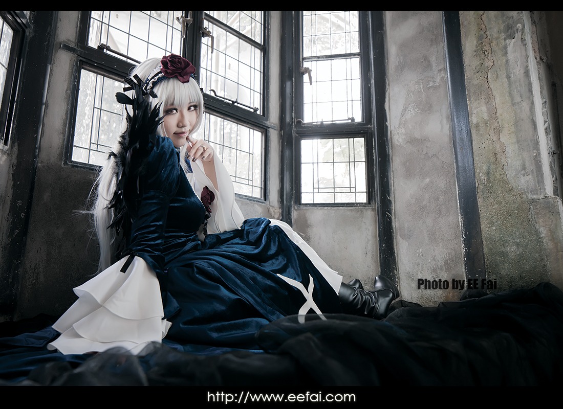 1girl flower hair_ornament indoors letterboxed long_hair sitting solo suigintou window