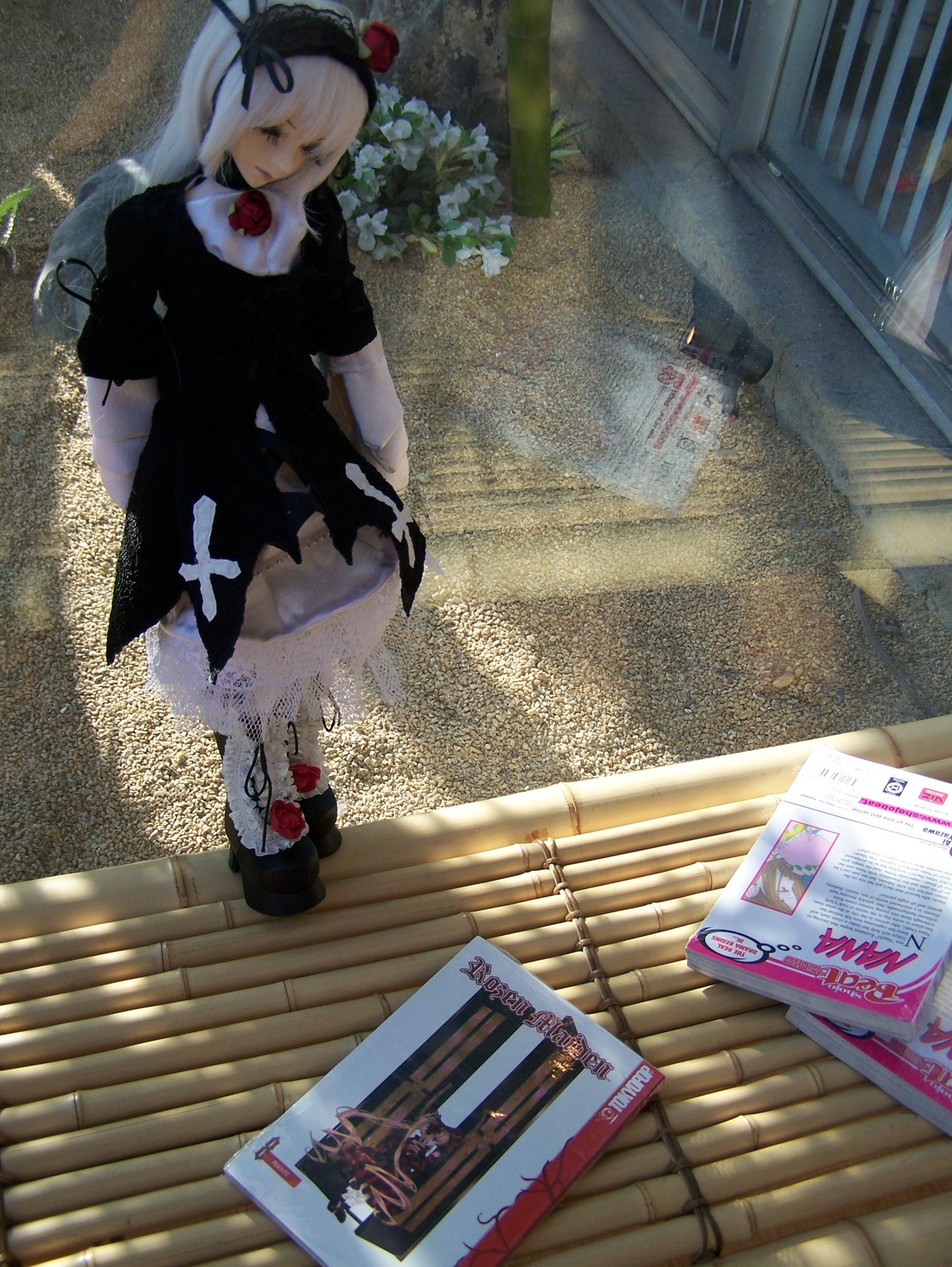 1girl auto_tagged black_dress closed_eyes doll dress flower hat photo solo standing suigintou