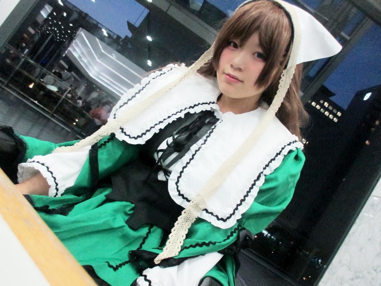 1girl 3d brown_hair building city dress green_dress head_scarf long_hair outdoors photo solo suiseiseki