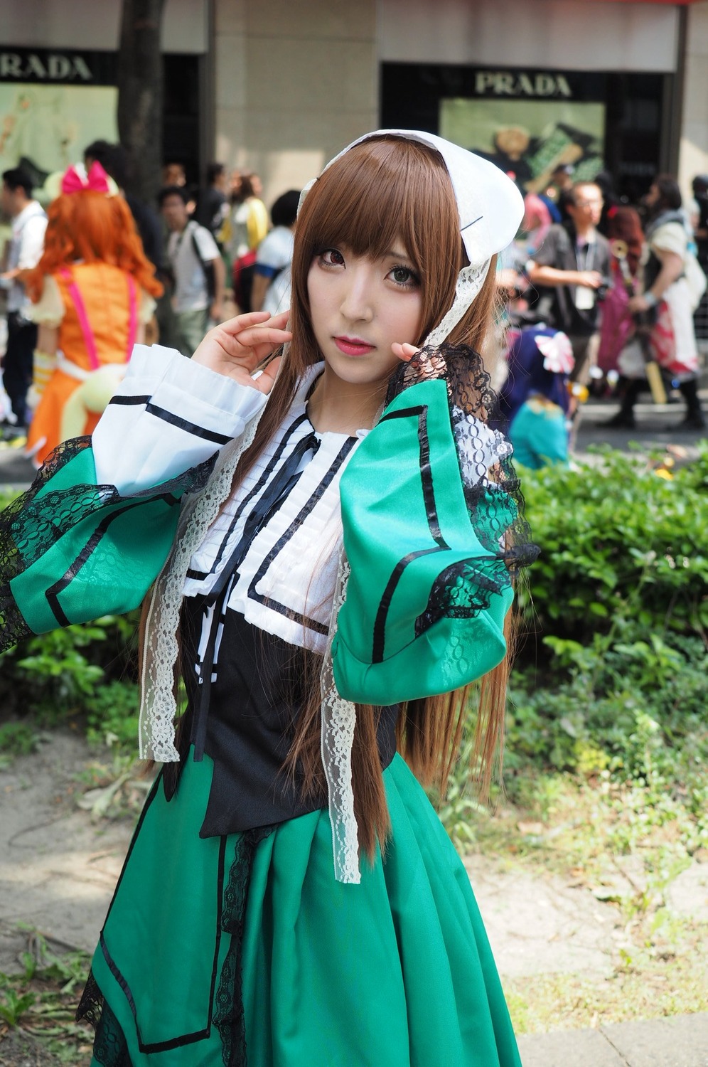 1girl 3d blurry brown_hair depth_of_field figure jacket looking_at_viewer outdoors photo photo_background realistic skirt solo standing suiseiseki