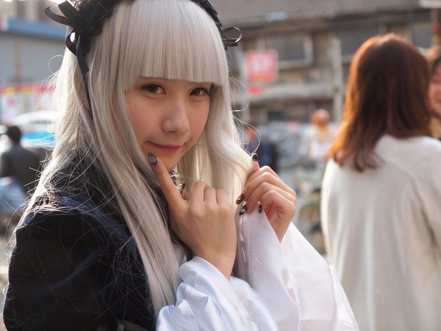 2girls bangs blunt_bangs blurry blurry_background blurry_foreground brown_hair closed_mouth depth_of_field indoors jewelry lips long_hair looking_at_viewer multiple_girls nail_polish outdoors photo realistic red_nails solo solo_focus suigintou upper_body white_hair