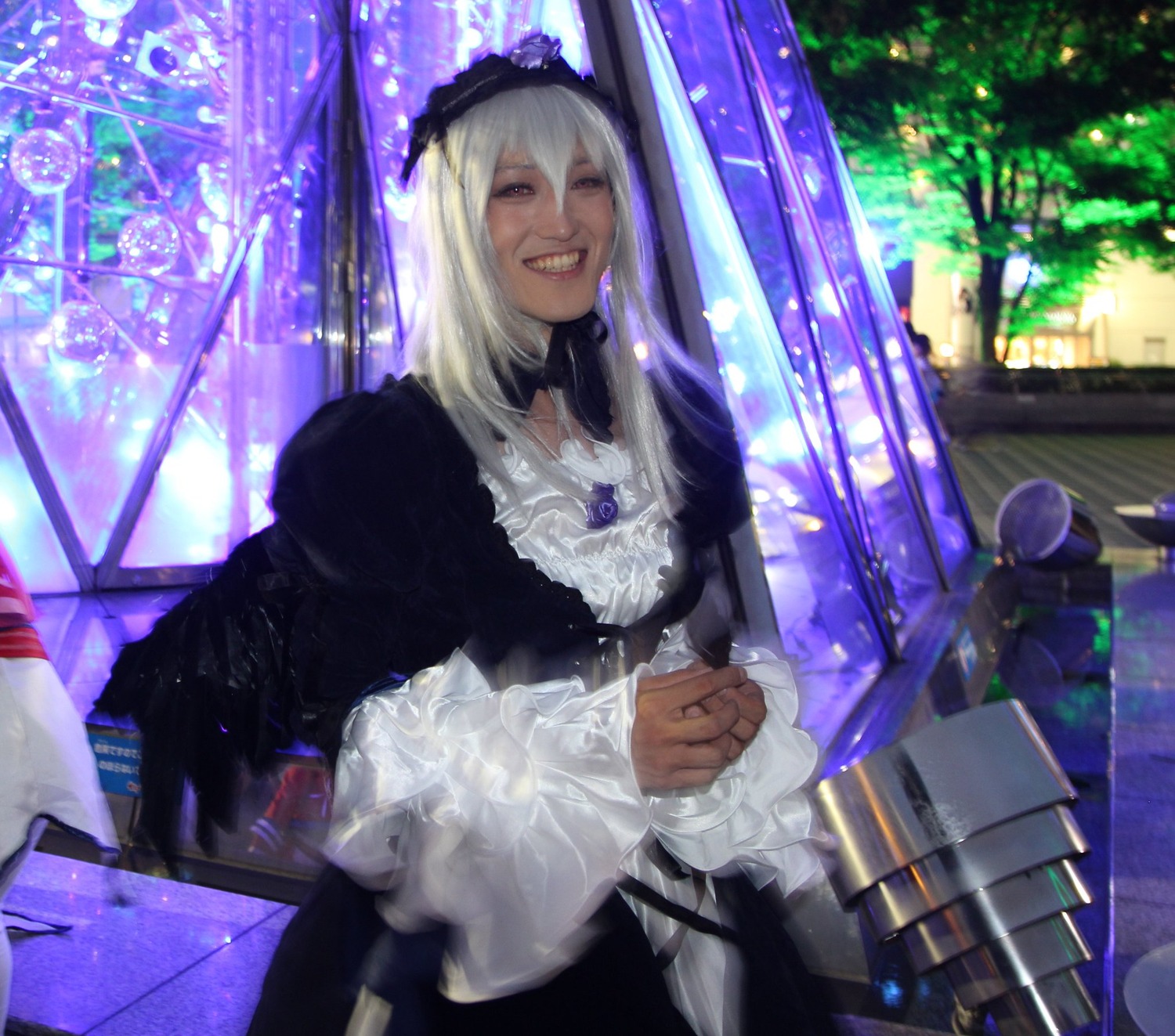 1girl black_dress dress frills indoors lipstick long_hair long_sleeves makeup smile solo stained_glass suigintou teeth