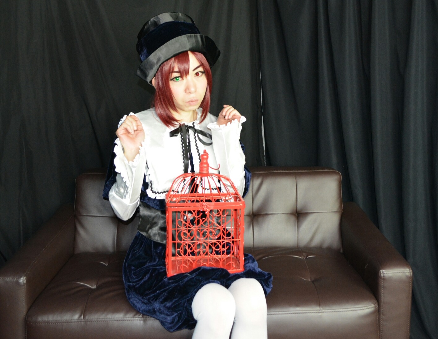 1girl couch frills green_eyes hat heterochromia lolita_fashion long_sleeves pantyhose red_eyes ribbon short_hair sitting solo souseiseki white_legwear
