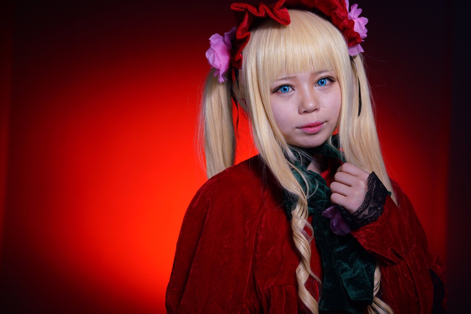 1girl bangs blonde_hair blue_eyes blunt_bangs flower hair_flower lips long_hair long_sleeves looking_at_viewer realistic red_background rose shinku smile solo twintails upper_body