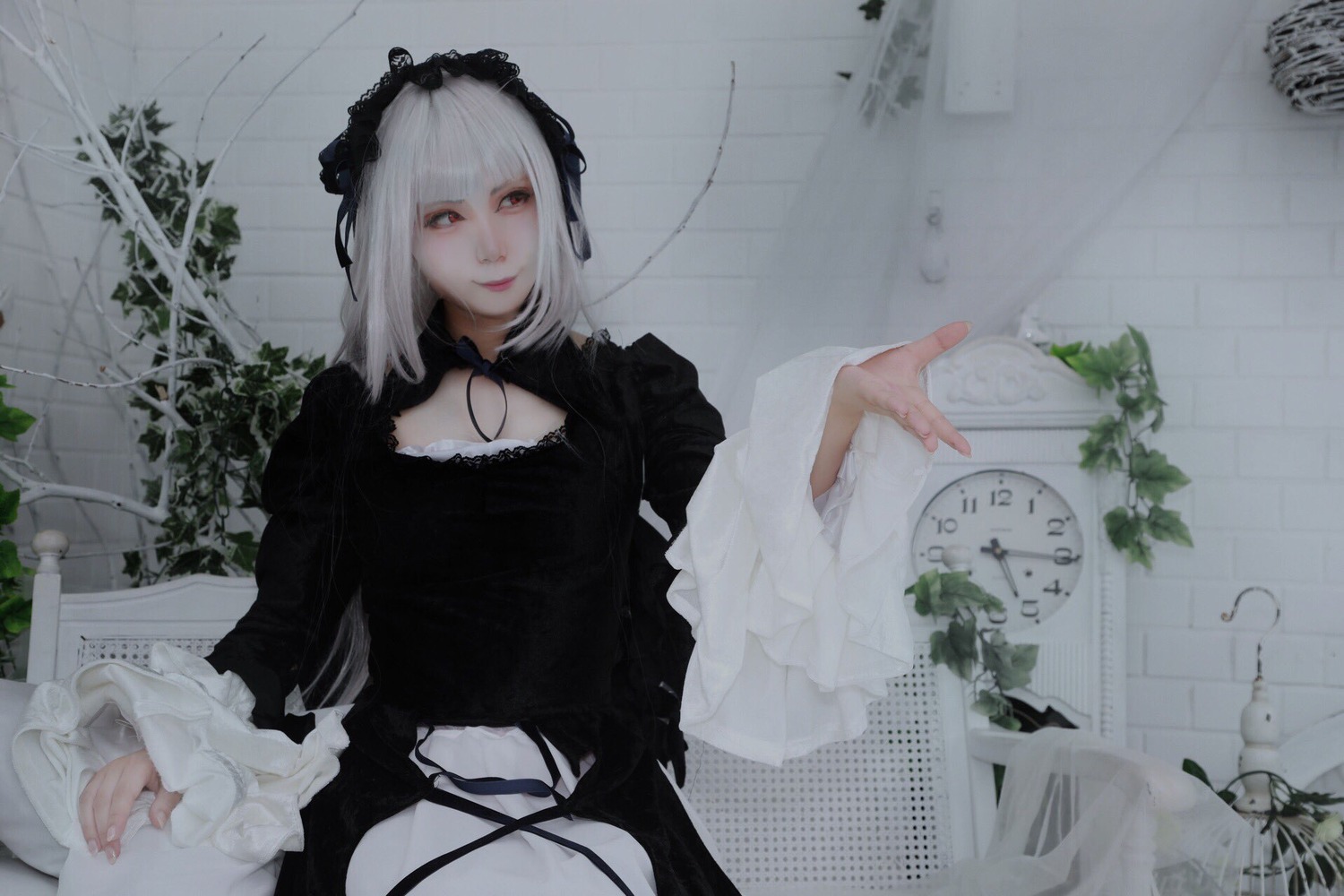 1girl black_dress black_ribbon closed_mouth dress flower frills gothic_lolita hairband lolita_fashion long_hair long_sleeves plant silver_hair solo suigintou vines white_hair