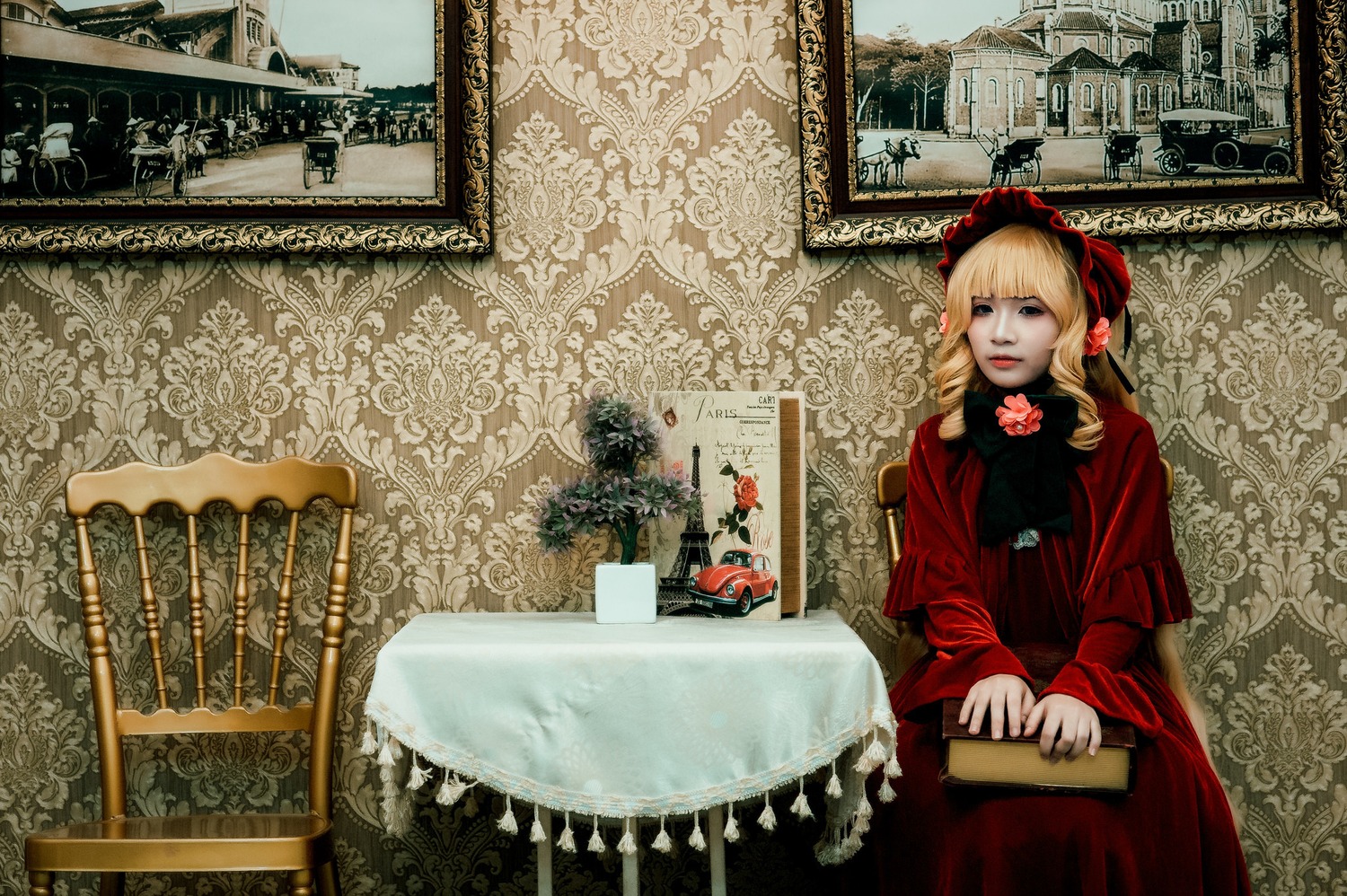 1girl blonde_hair blue_eyes building dress flower jewelry long_hair long_sleeves red_dress solo