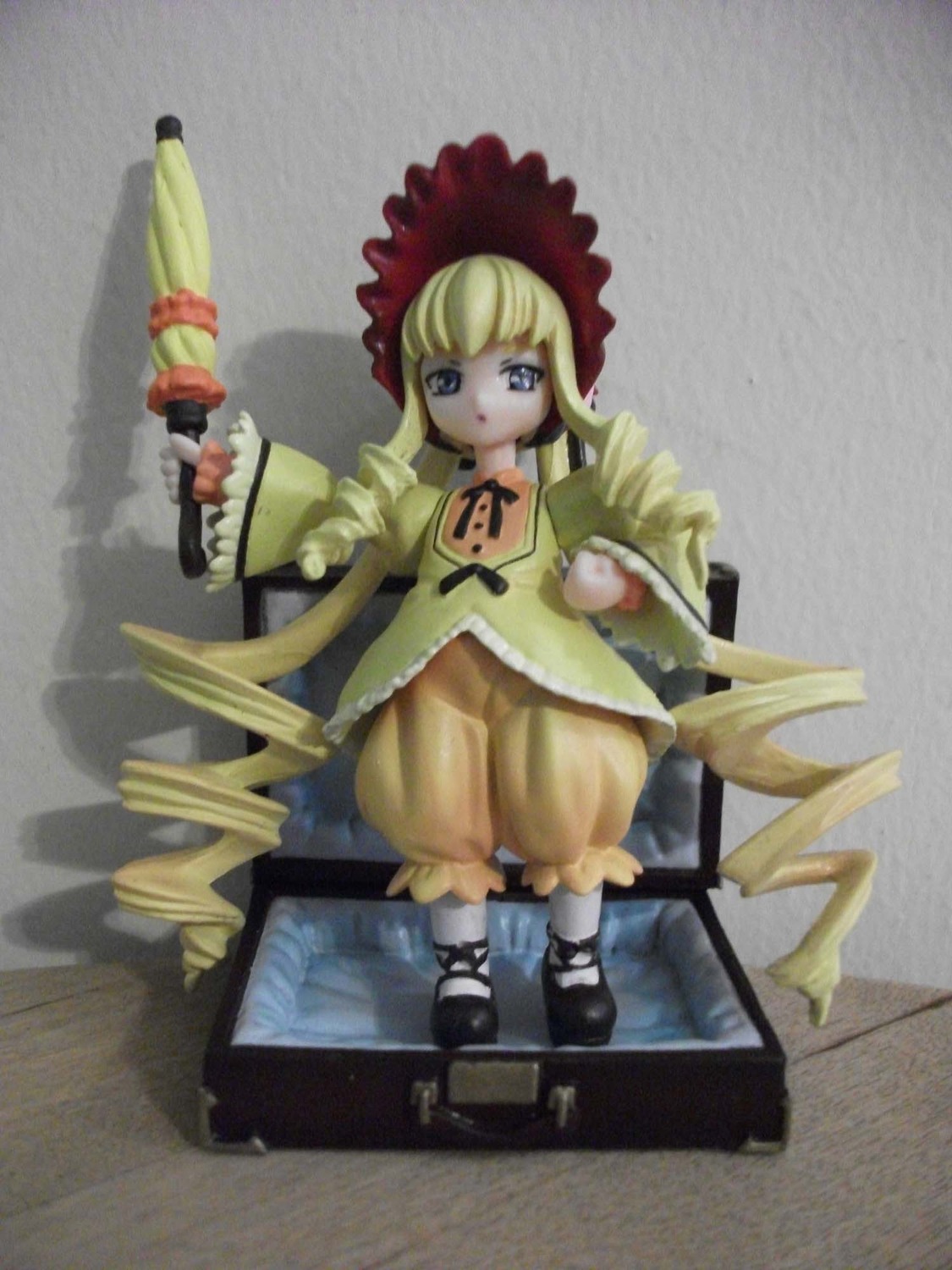 1girl bangs black_footwear blonde_hair bloomers blue_eyes bonnet bow bowtie doll dress drill_hair frills full_body holding long_hair long_sleeves looking_at_viewer photo shinku shoes solo standing twin_drills twintails underwear very_long_hair