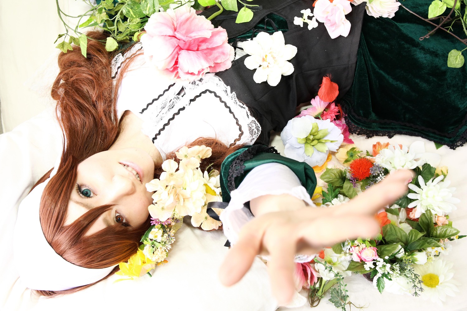 1girl ahoge blue_eyes blurry brown_hair depth_of_field dress flower foreshortening green_eyes heterochromia jewelry lips long_hair looking_at_viewer necklace red_eyes solo suiseiseki white_flower