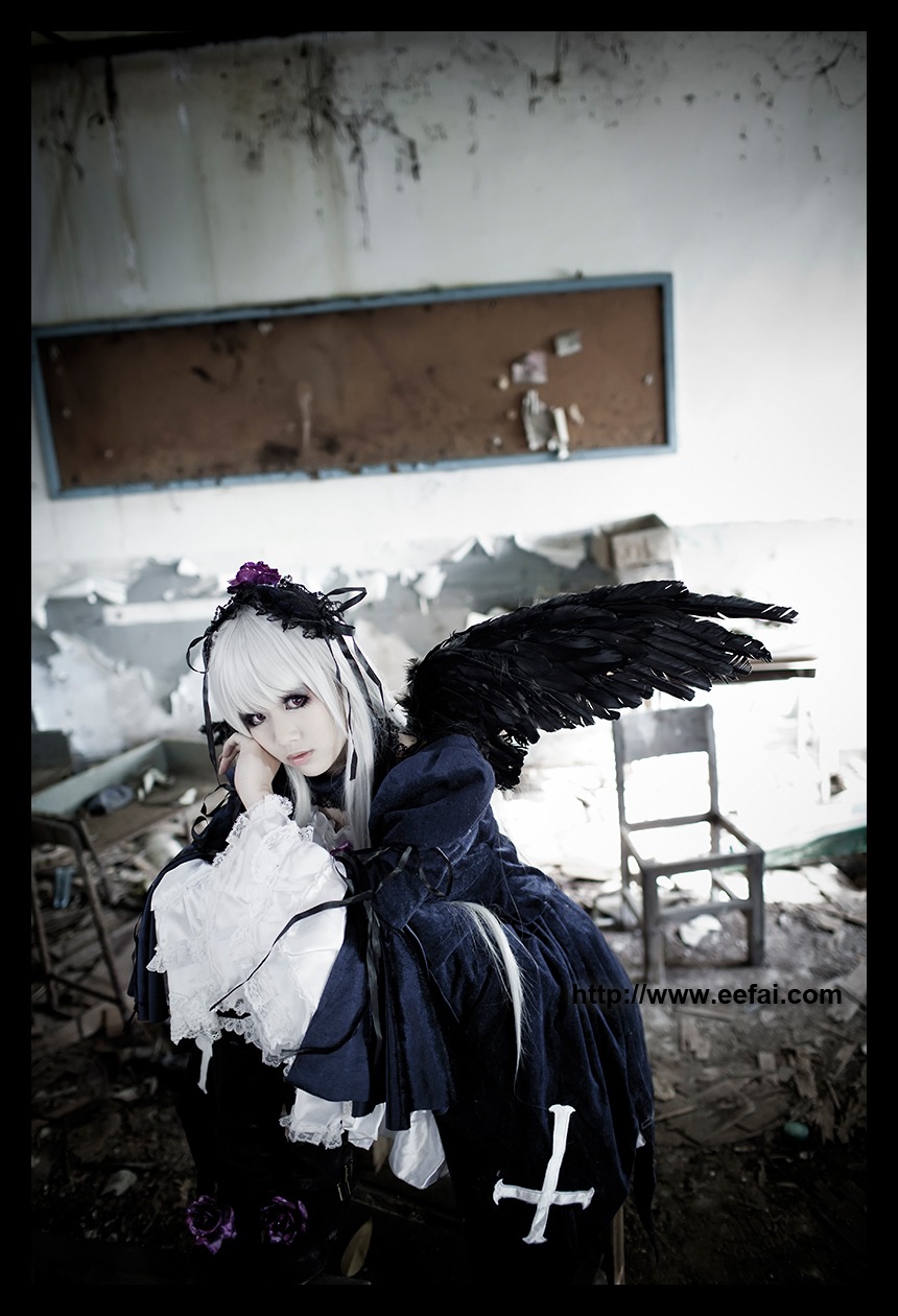 1girl black_border black_wings blurry border dress feathers flower frills hairband letterboxed long_sleeves looking_at_viewer pillarboxed silver_hair solo suigintou wings
