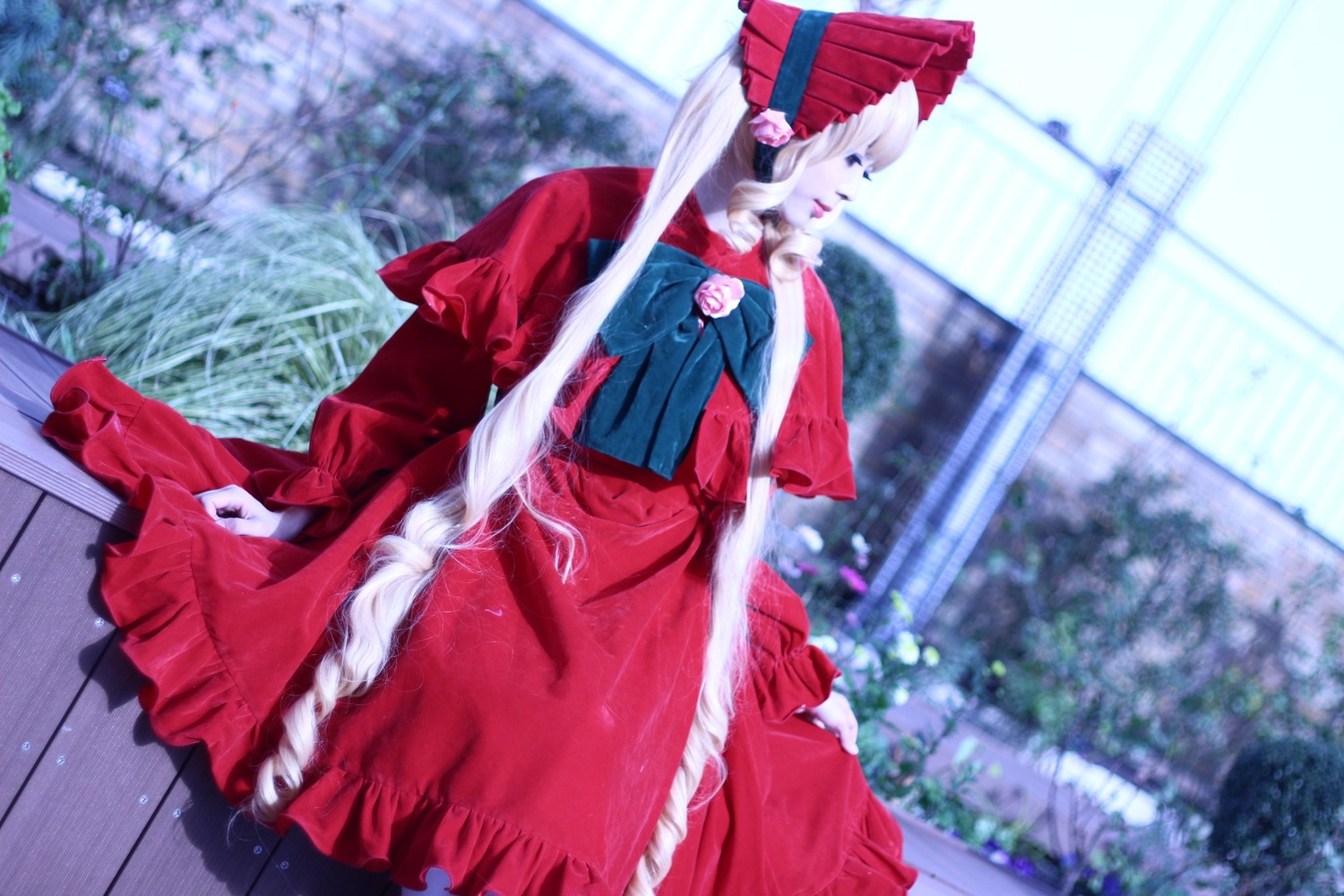 1girl blurry blurry_background blurry_foreground building chain-link_fence depth_of_field dress fence frills long_hair no_humans outdoors shinku solo umbrella