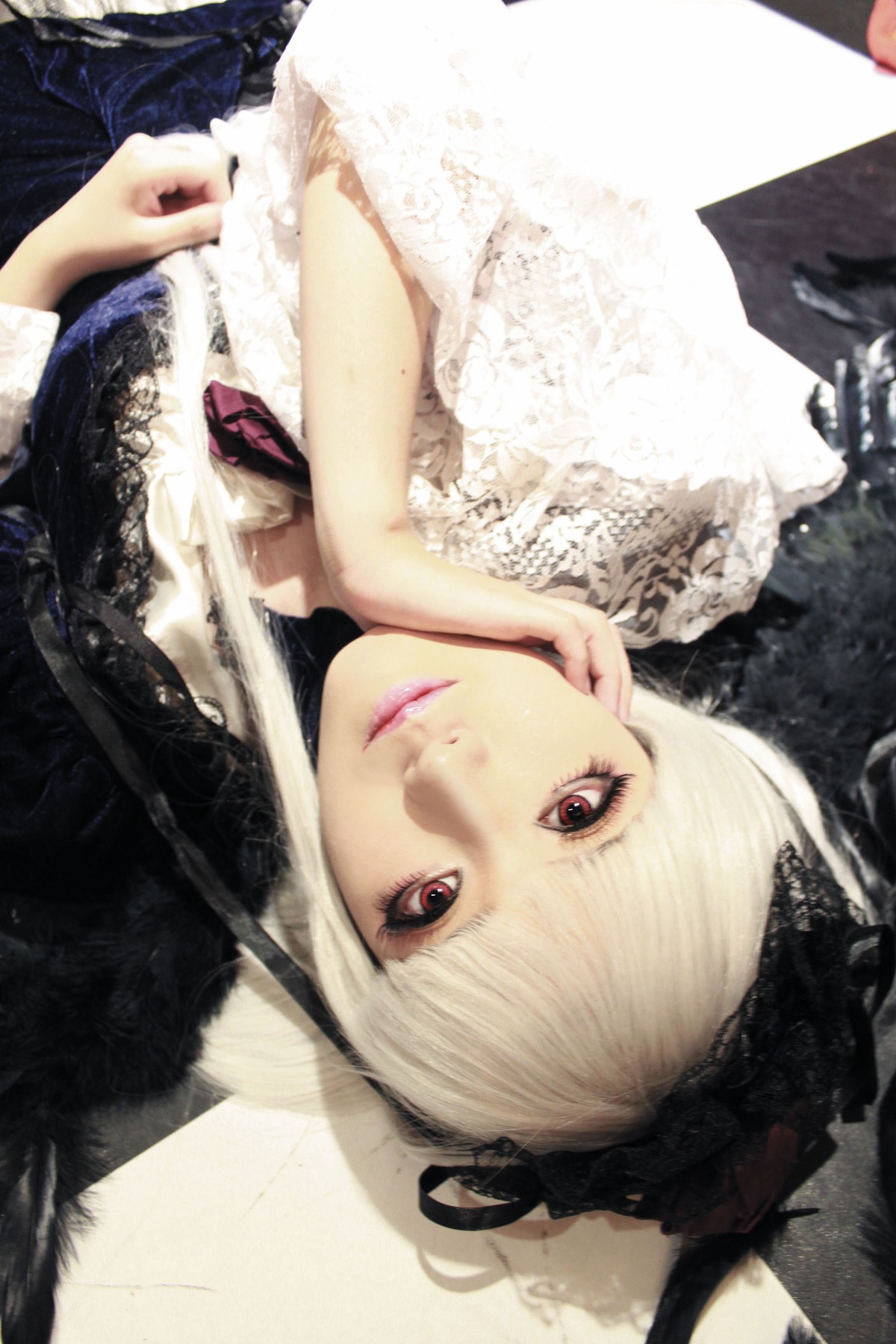 1girl bangs closed_mouth feathers fur fur_trim lips looking_at_viewer red_eyes solo suigintou upper_body