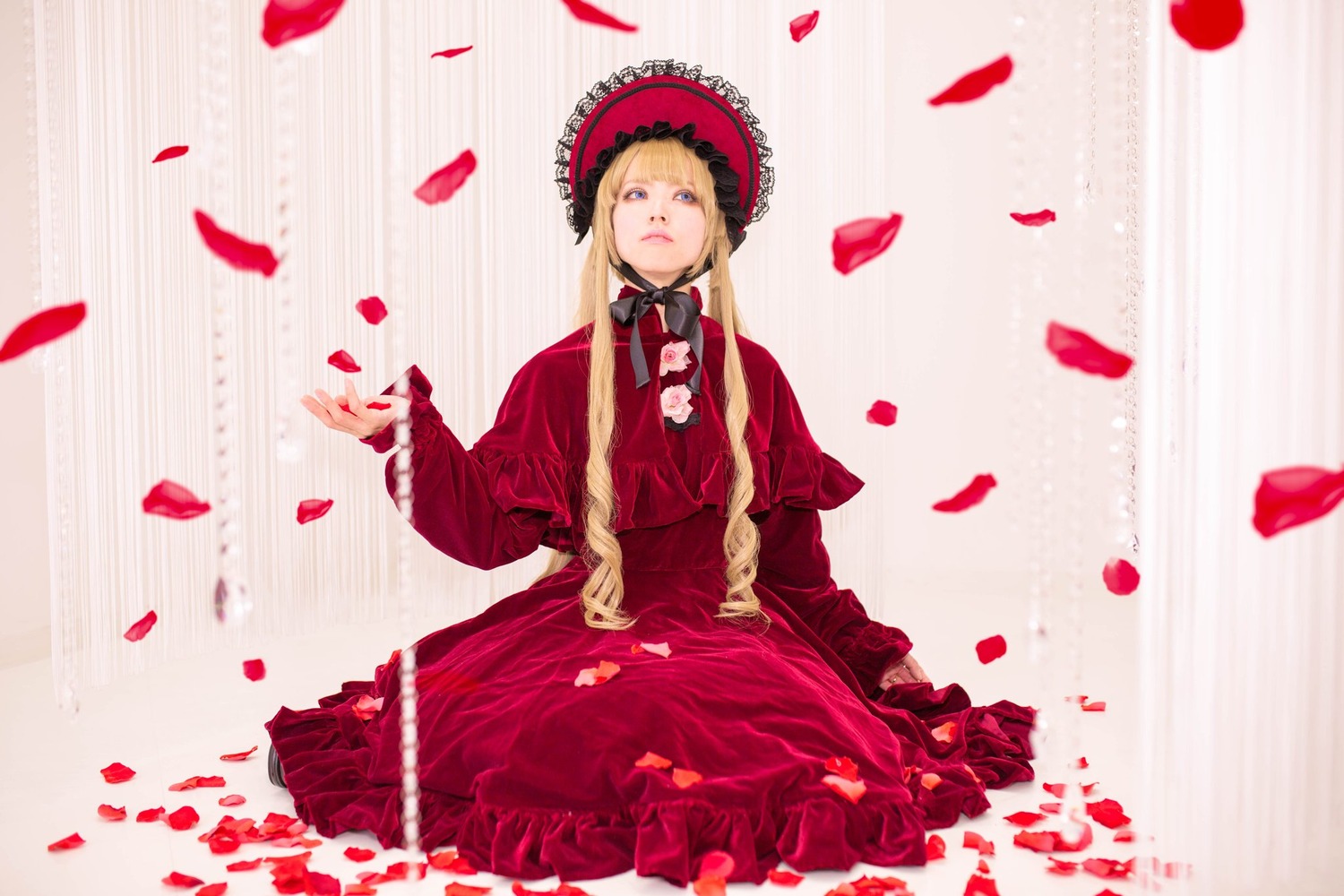 1girl blonde_hair blue_eyes bonnet dress flower long_hair petals red_dress rose rose_petals shinku sitting solo striped