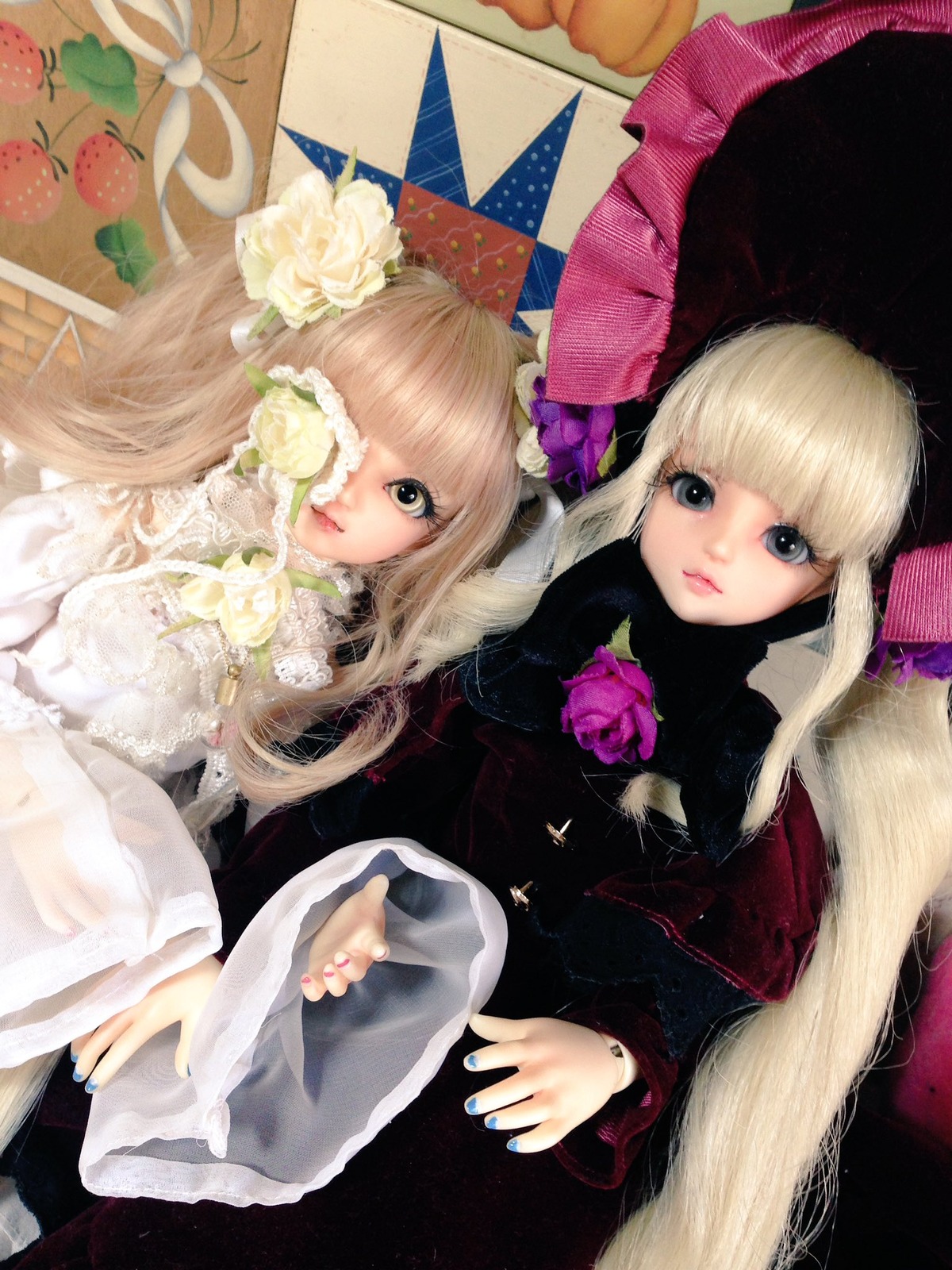 2girls blonde_hair blue_nails doll dress fingernails flower fruit green_nails lips long_hair multiple_dolls multiple_girls nail_polish purple_nails red_nails ring rose tagme