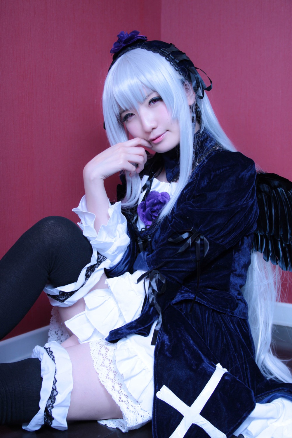 1girl black_legwear dress frills gothic_lolita hairband lolita_fashion long_hair long_sleeves sitting solo suigintou thighhighs