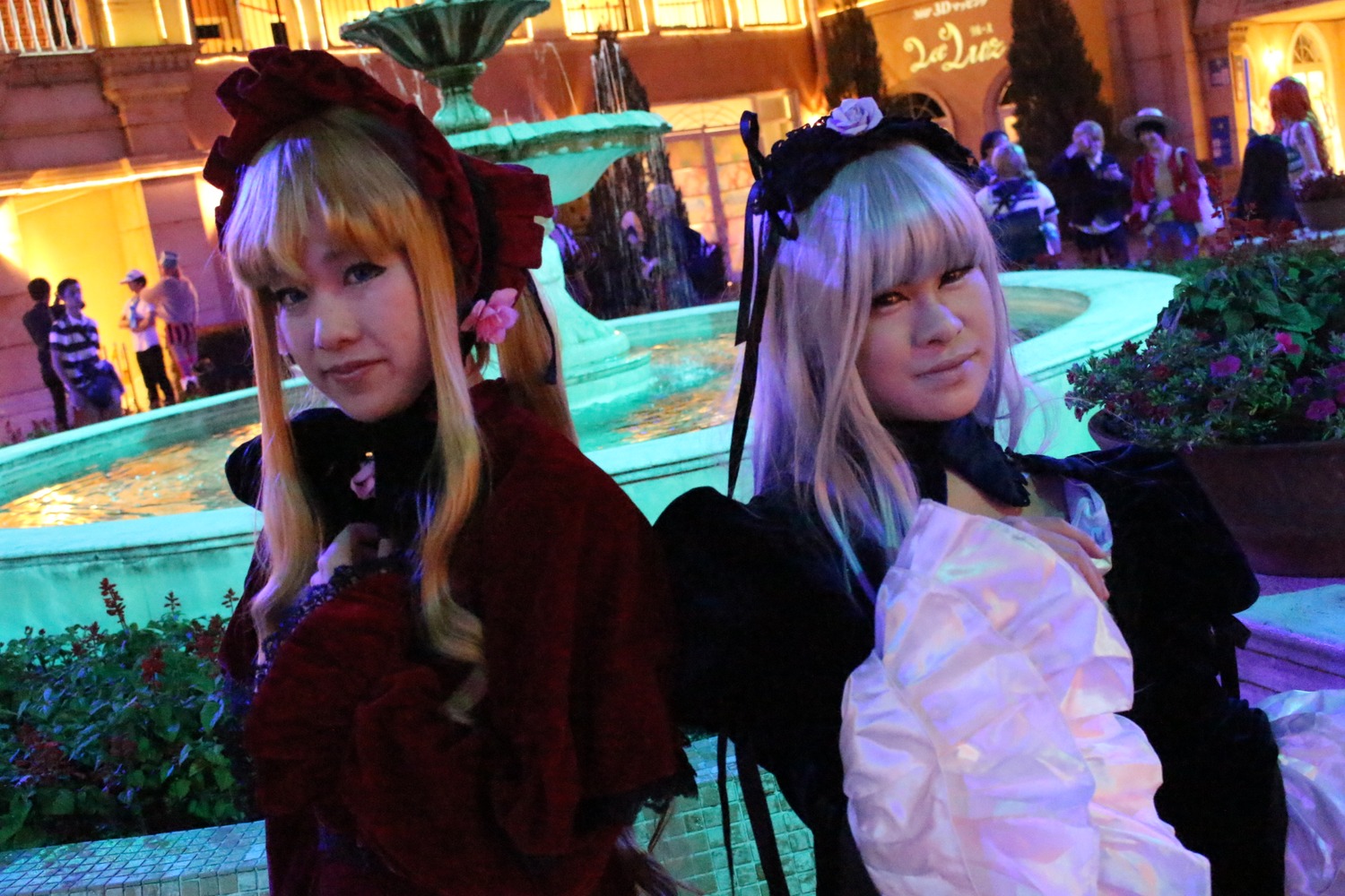 2girls blonde_hair dress flower hat long_hair mini_hat multiple_girls solo suigintou