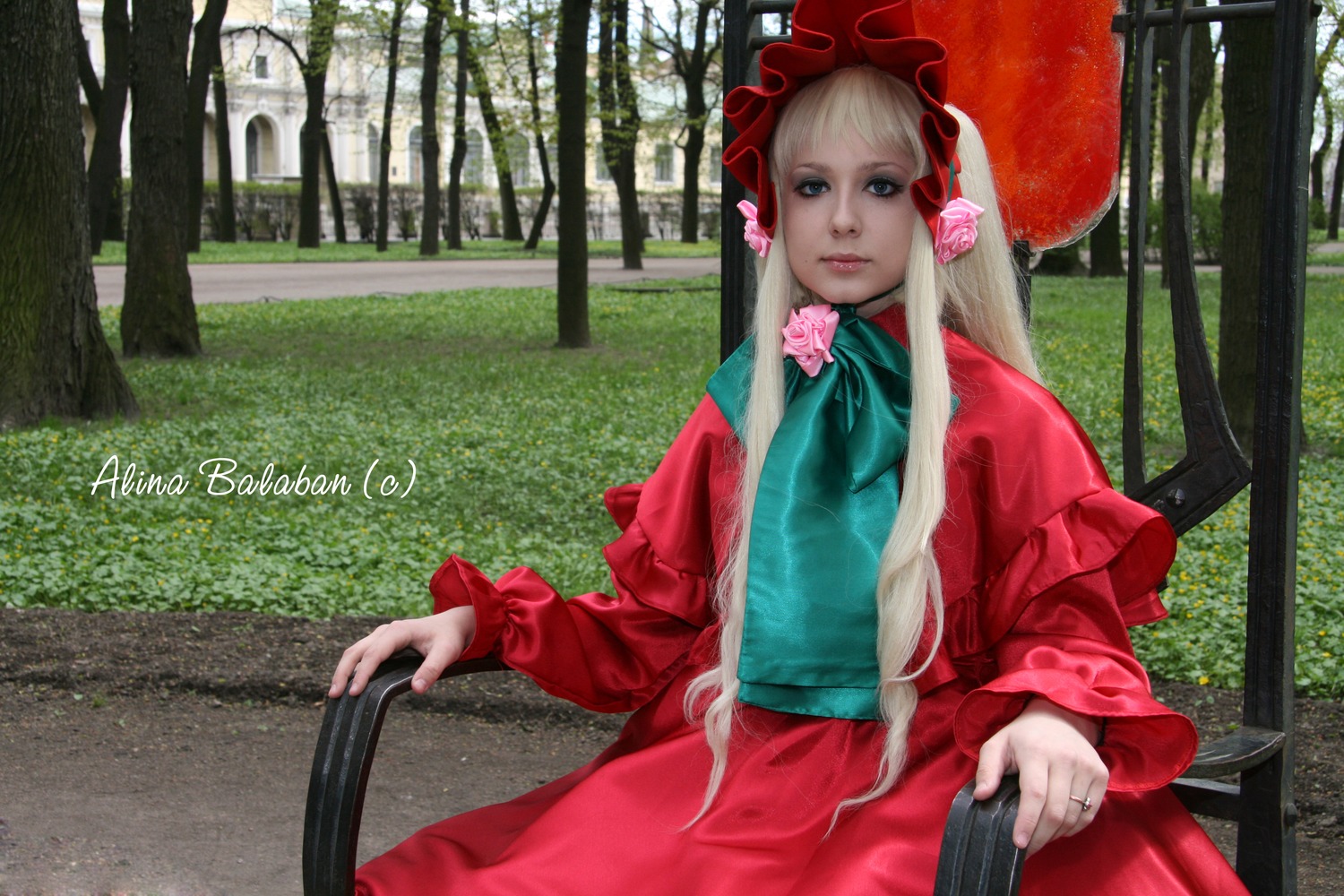 1girl artist_name blonde_hair blue_eyes bonnet dress flower long_hair long_sleeves looking_at_viewer outdoors pink_flower red_dress shinku solo