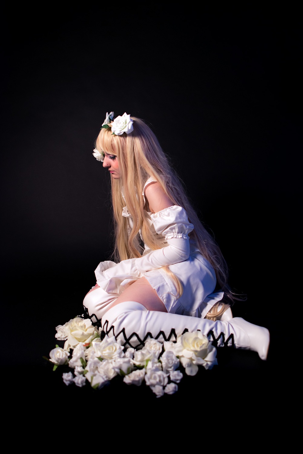 1girl bangs bare_shoulders black_background blonde_hair dress elbow_gloves flower from_side full_body gloves hair_ornament kirakishou long_hair profile sitting solo thighhighs very_long_hair wariza white_dress white_flower white_footwear white_gloves white_legwear