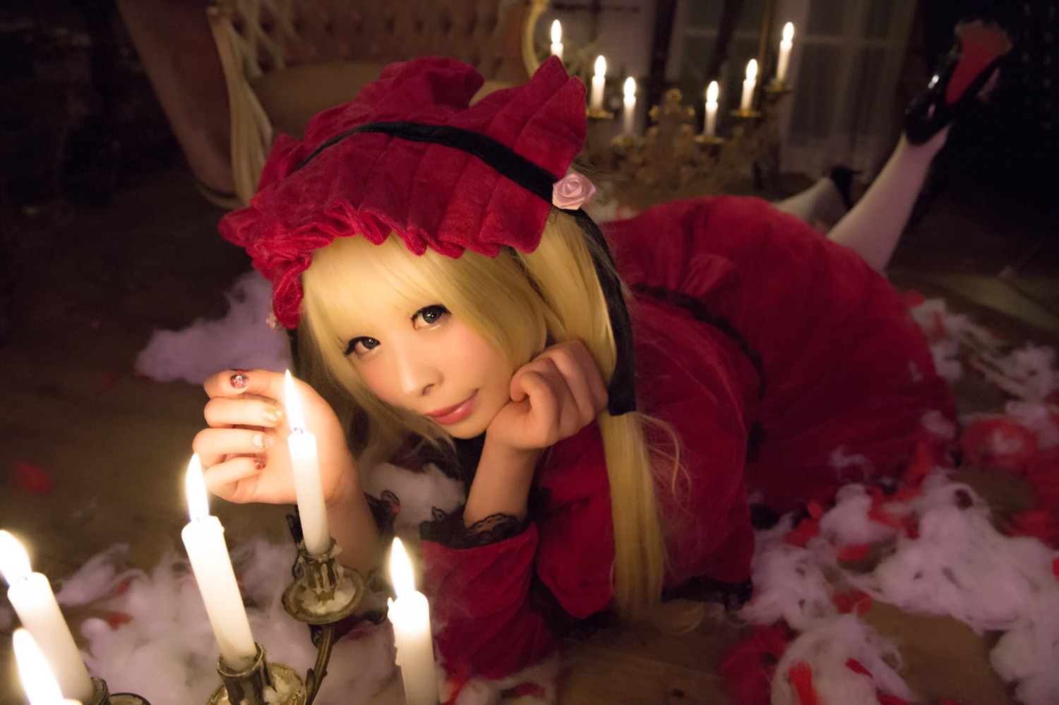 1girl blonde_hair bonnet dress flower lips lolita_fashion long_hair long_sleeves looking_at_viewer lying on_stomach pipe red_dress rose shinku solo