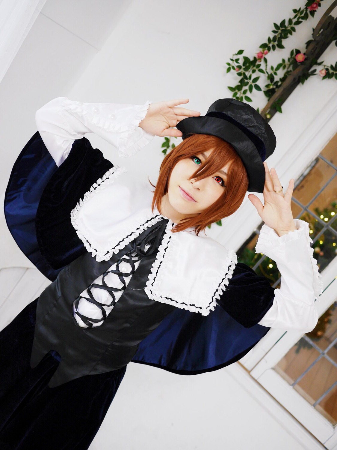 1girl brown_hair capelet dress green_eyes hat heterochromia lips long_sleeves looking_at_viewer red_eyes ribbon short_hair smile solo souseiseki
