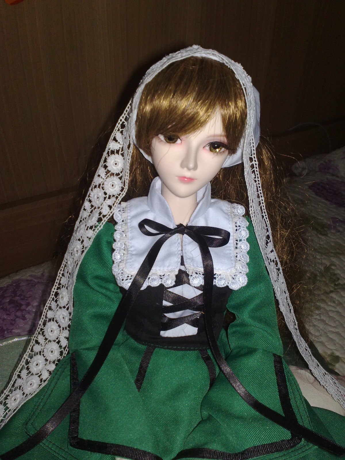 1girl bangs black_ribbon brown_eyes brown_hair closed_mouth doll dress frills green_dress lips long_hair long_sleeves looking_at_viewer neck_ribbon ribbon solo suiseiseki upper_body veil