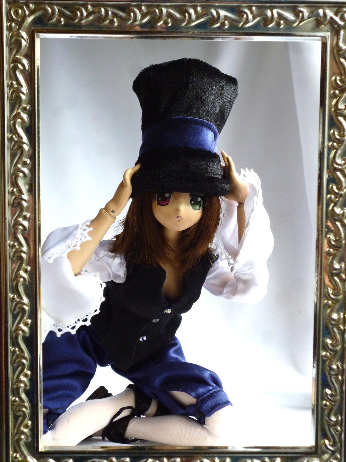 1girl border brown_hair doll dress fishnet_legwear fishnets green_eyes hat heterochromia jewelry long_hair long_sleeves looking_at_viewer red_eyes simple_background sitting solo souseiseki