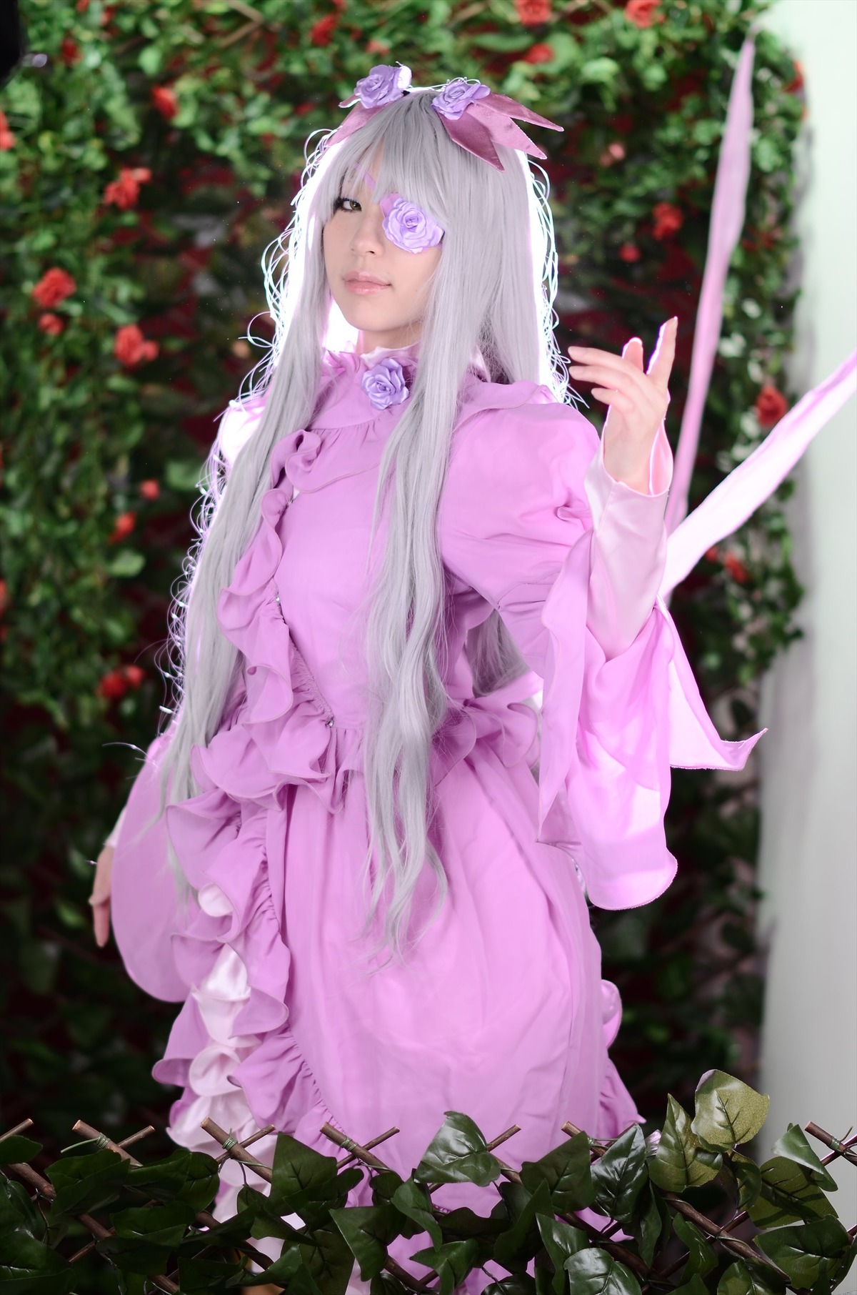 1boy barasuishou blindfold blurry blurry_background blurry_foreground depth_of_field dress eyepatch flower long_hair pink_dress plant rose solo standing very_long_hair weapon