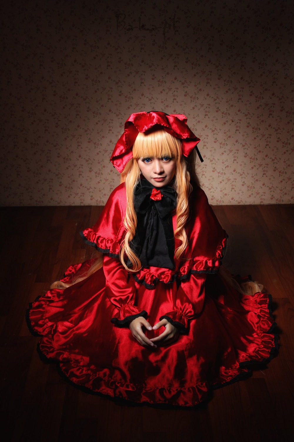 1girl auto_tagged blonde_hair blue_eyes bow capelet dress lips long_hair long_sleeves looking_at_viewer realistic red_capelet red_dress shinku solo