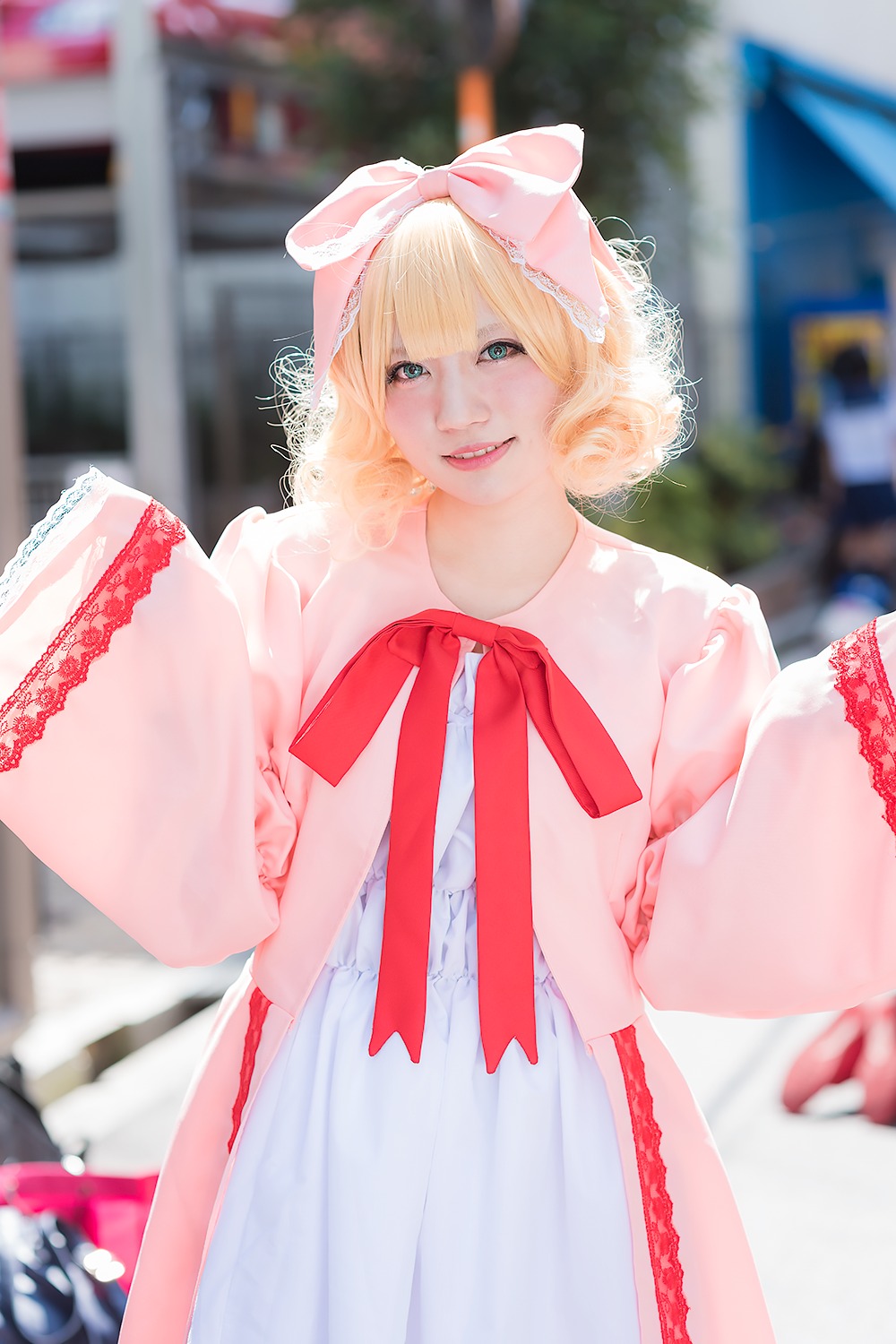 1girl 3d artist_name blonde_hair blurry blurry_background blurry_foreground bow day depth_of_field dress hair_bow hinaichigo lips looking_at_viewer motion_blur outdoors photo photo_background realistic ribbon short_hair smile solo watermark web_address white_dress