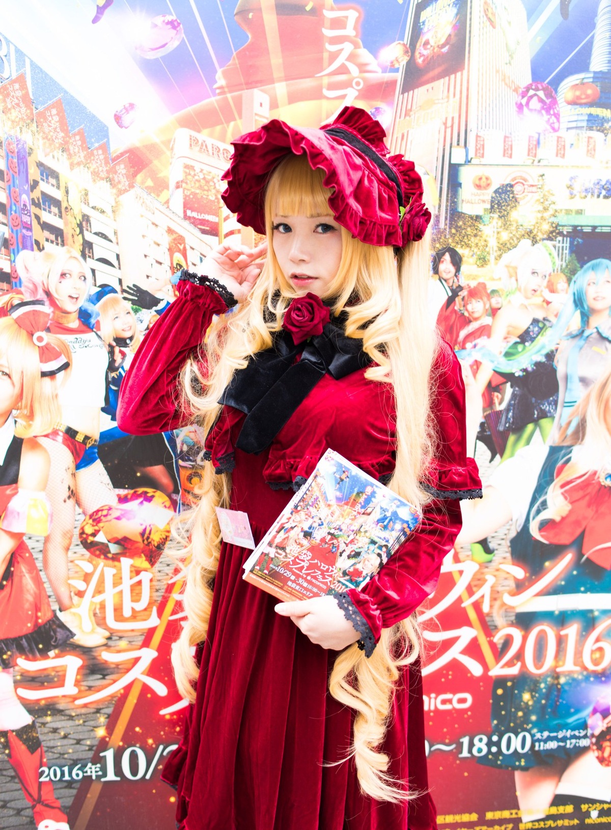 1girl blonde_hair blue_eyes bonnet city dress flower hat long_hair rose shinku solo