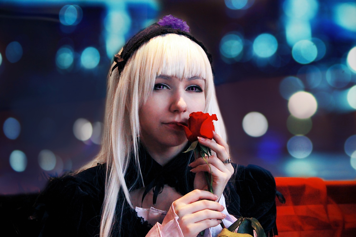 1girl bangs blurry blurry_background bokeh depth_of_field flower hairband holding holding_flower lens_flare lips long_hair long_sleeves solo suigintou upper_body white_hair