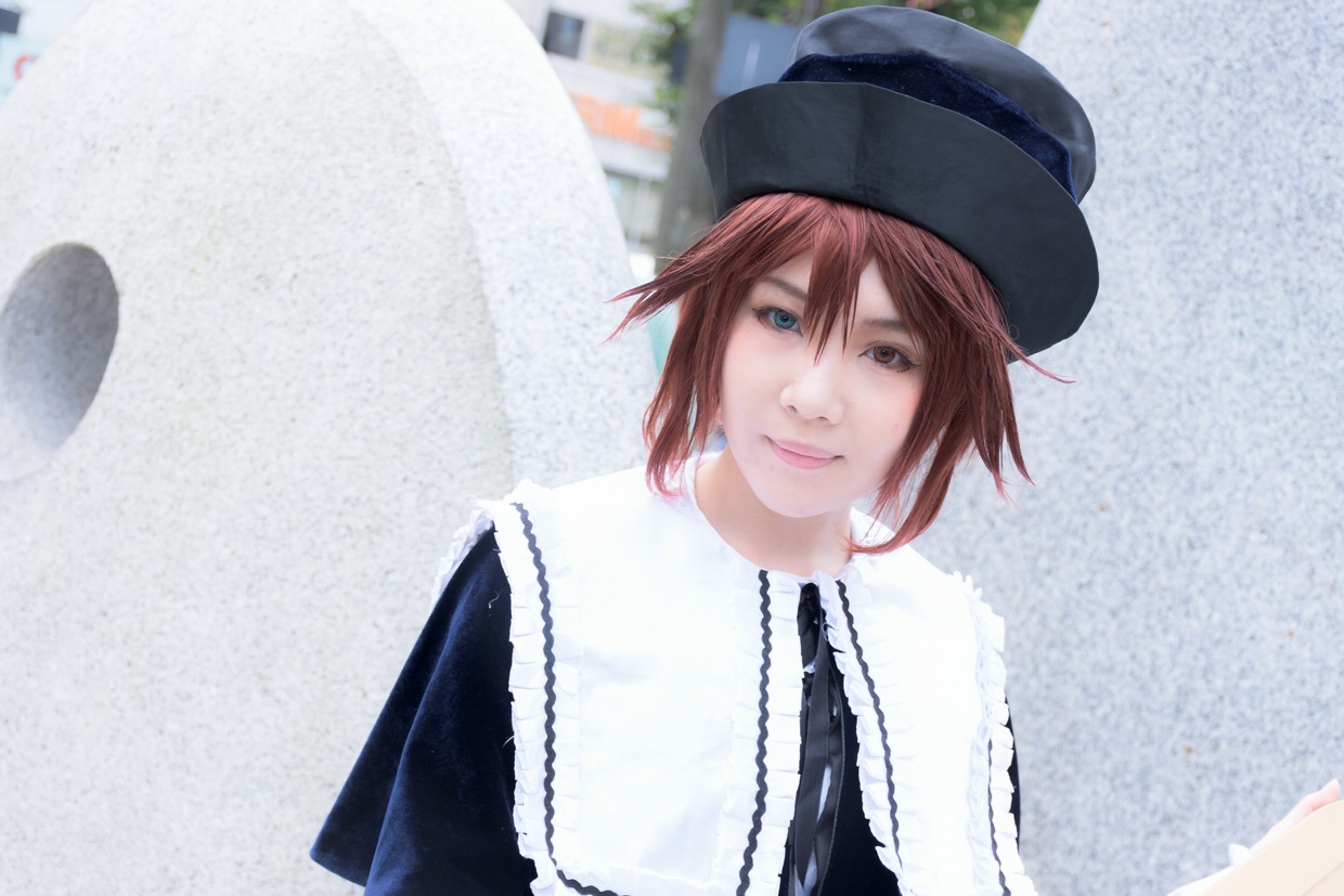 1girl blurry brown_hair building hat lips looking_at_viewer photo shirt smile solo souseiseki striped upper_body