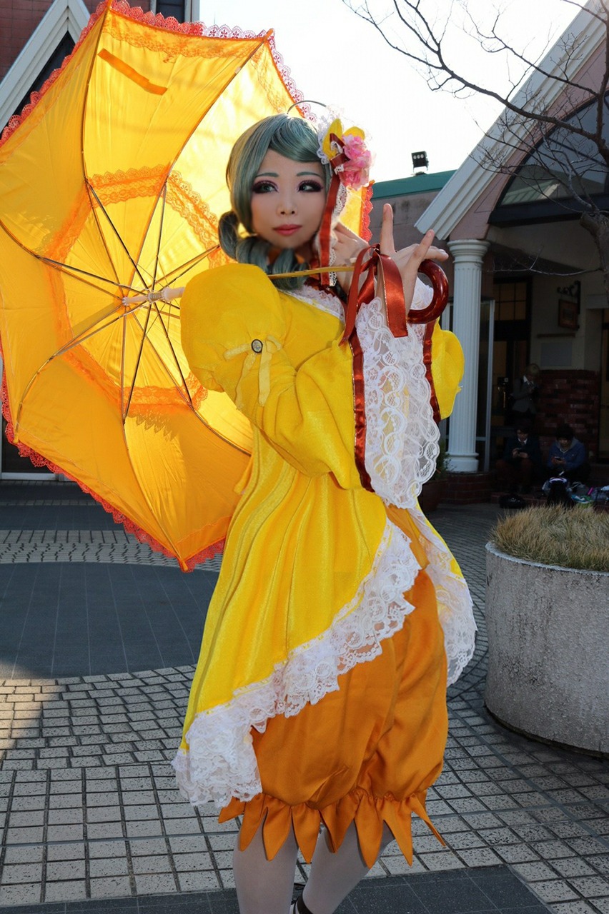 1girl black_eyes black_hair dress flower full_body hair_ornament holding_umbrella kanaria outdoors parasol red_umbrella solo standing transparent_umbrella umbrella wide_sleeves