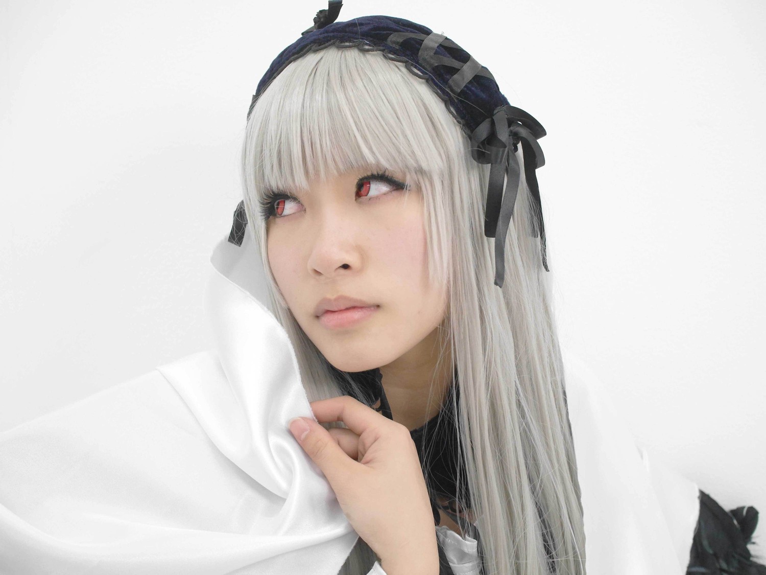 1girl bangs closed_mouth hairband lips long_hair portrait red_eyes solo suigintou