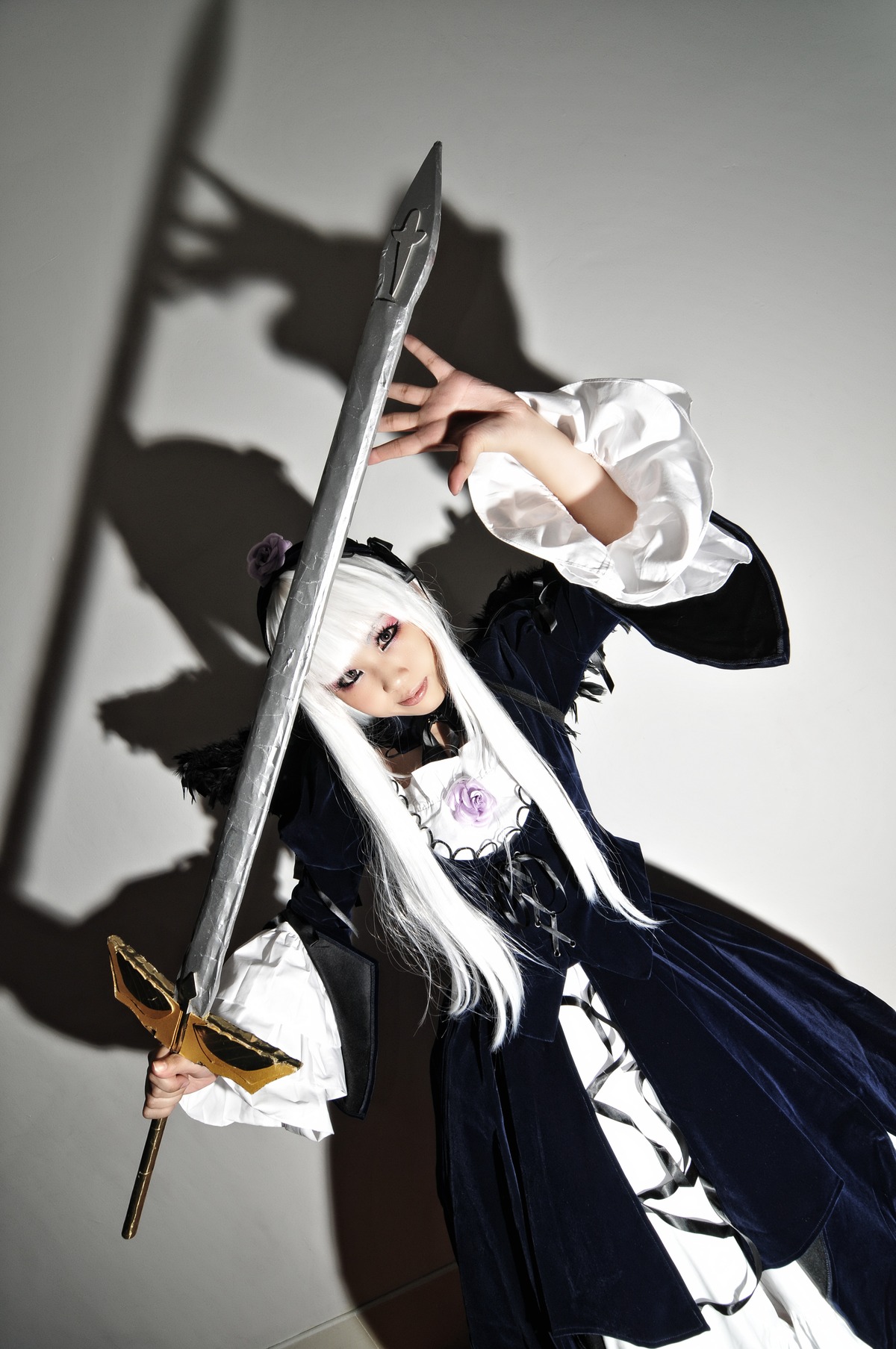 1girl 3d blurry depth_of_field dress holding holding_sword holding_weapon long_hair long_sleeves looking_at_viewer solo standing suigintou sword weapon white_hair